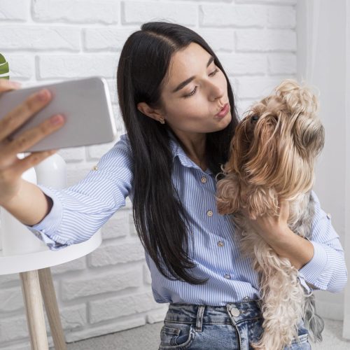 female-vlogger-home-with-smartphone female-vlogger-home-with-smartphone
